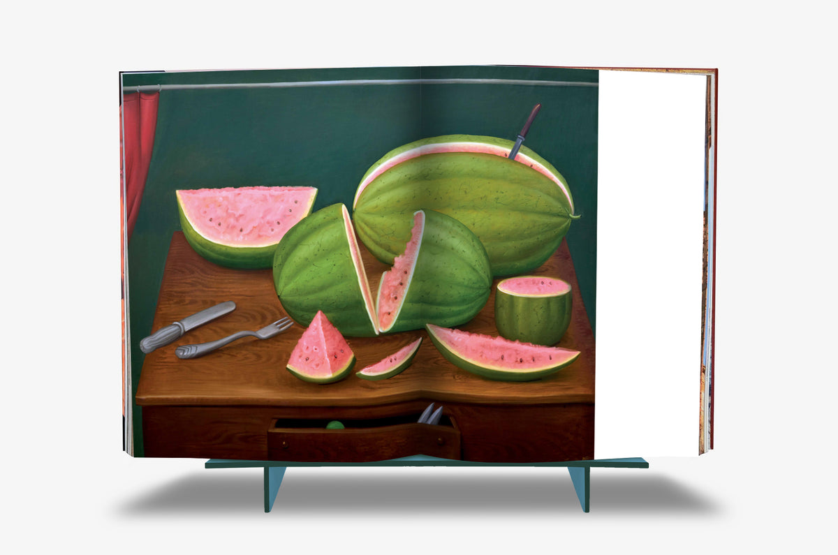 Fernando Botero XXL by Assouline: Full-spread reproduction of Botero's water melon still life — halved and sliced watermelons with vivid pink flesh massed on a wooden sideboard, a knife and fork in the foreground, against a deep teal background with red curtain.